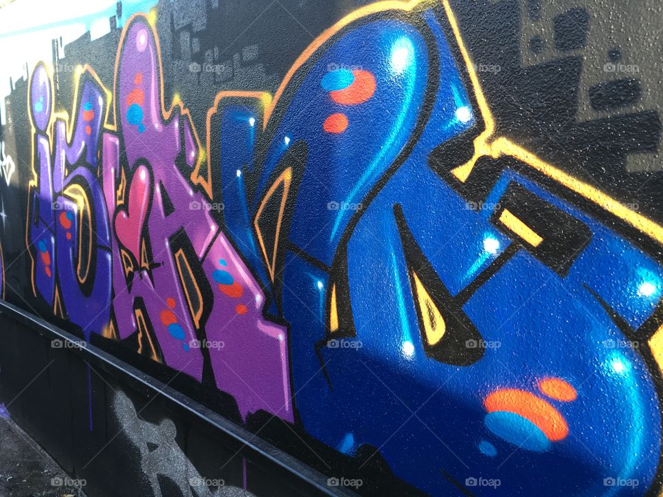 Art on a wall or perhaps a train arriving now.