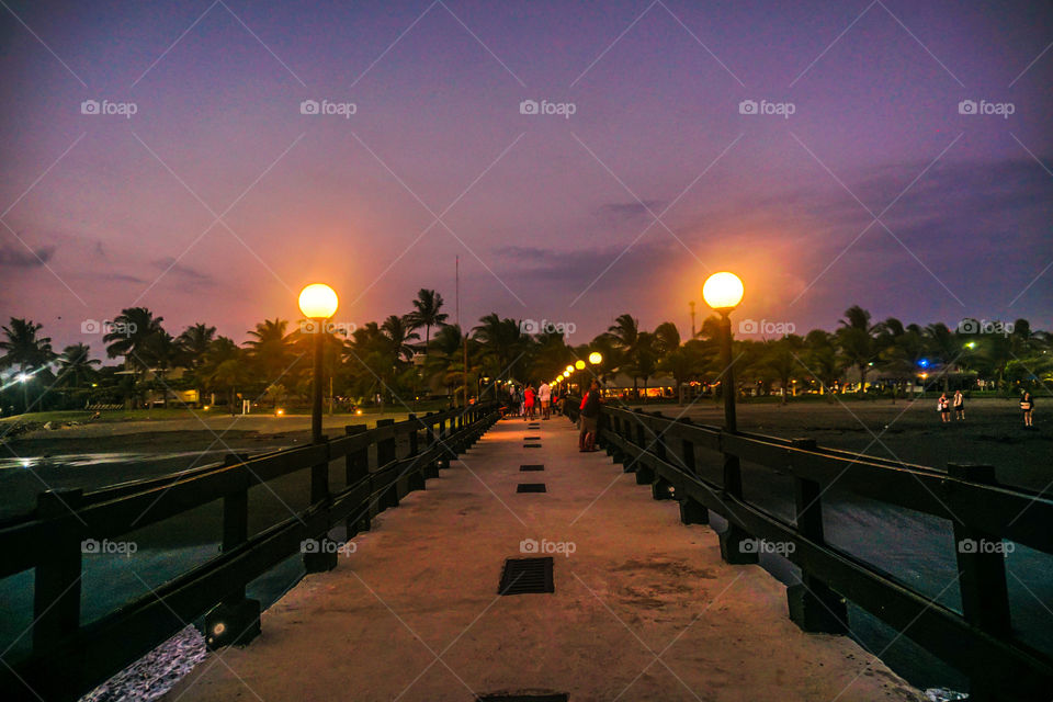 Sunset on a pier on the beaches of the Caribbean