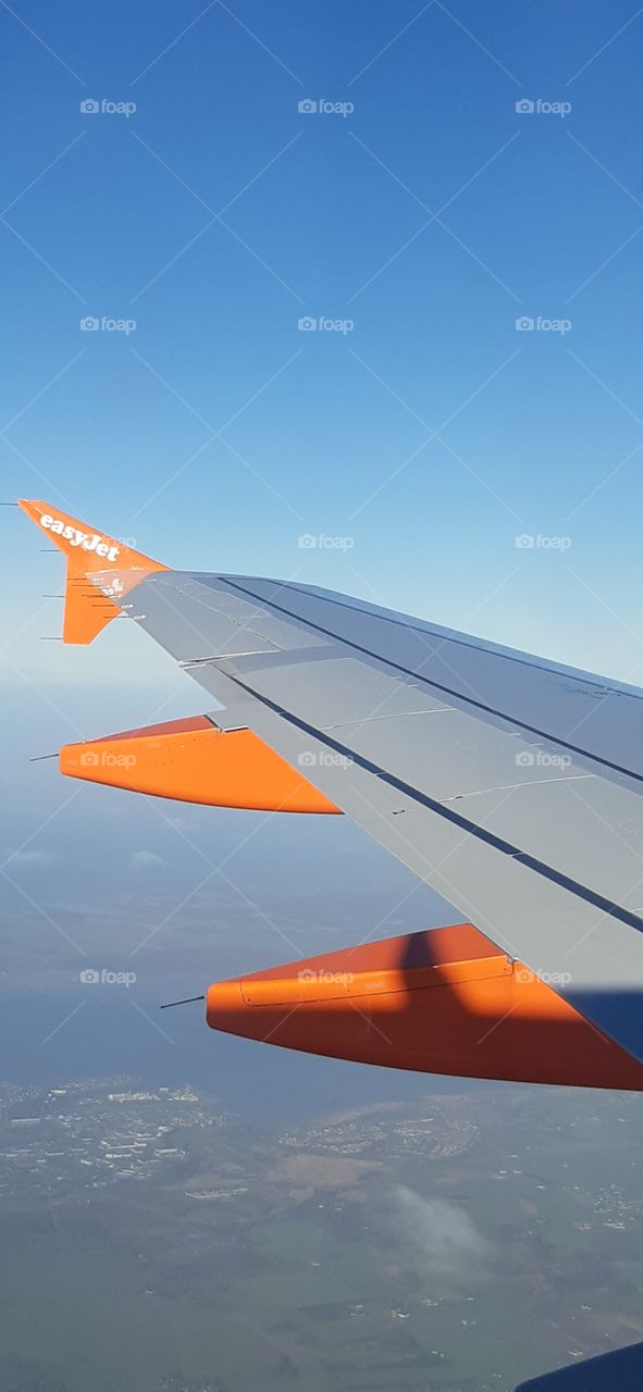 Wing of a aeroplane taken while flying in the air