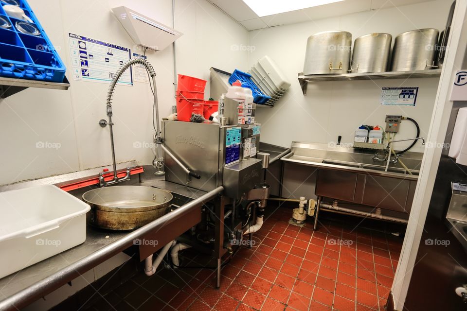 Kitchen storage cleaning equipment inside the restaurant 