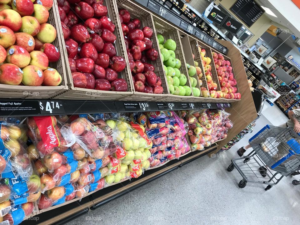 Rainbow colored fruit for sale.