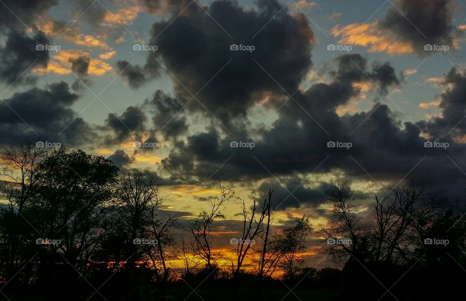 Dramatic cloud filled sky at sunset