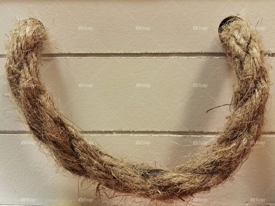 wicken rope on a white wooden background