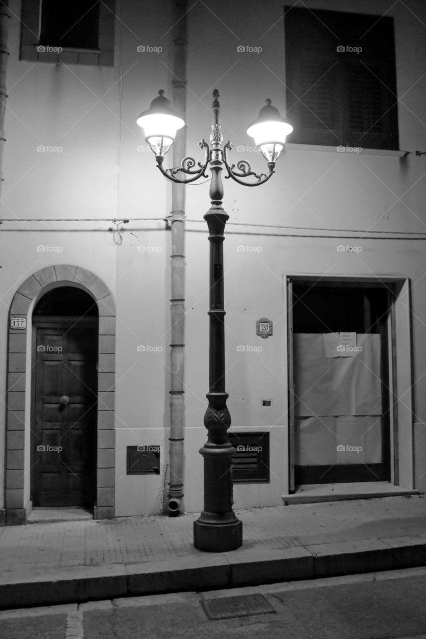 Illuminated street light during night