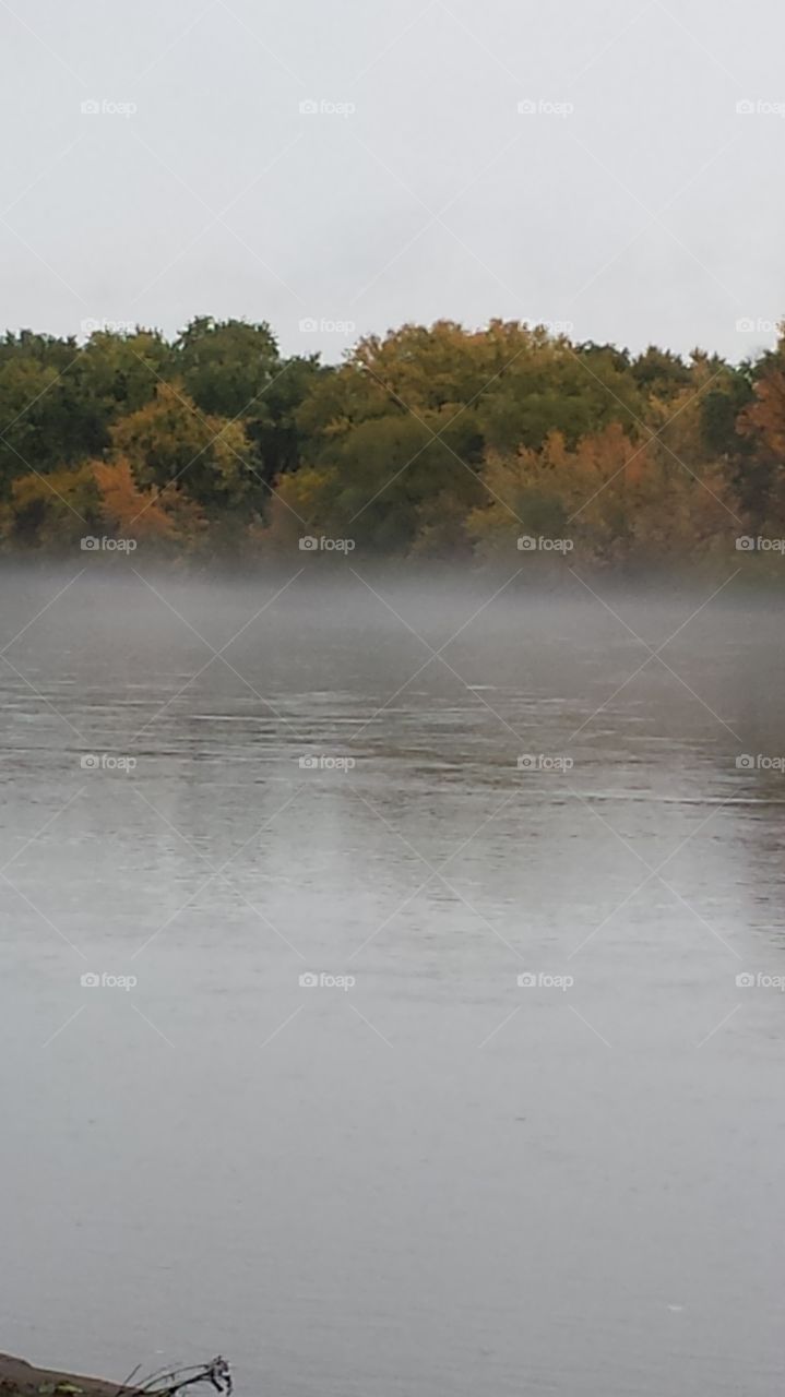 Fog in early morning on a river in Iowa.