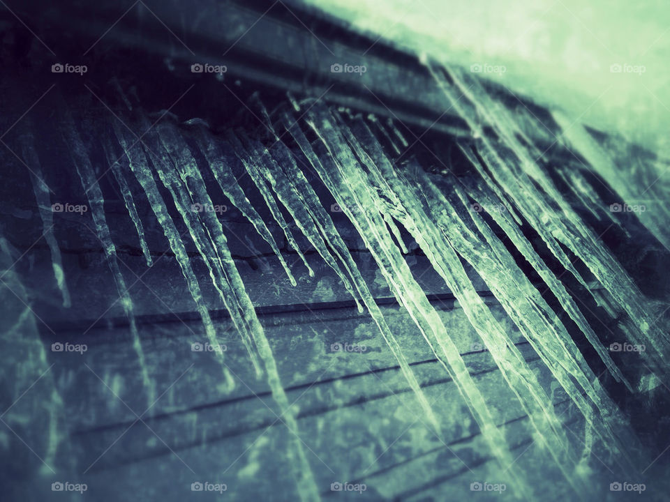 Icicles hang over the roof