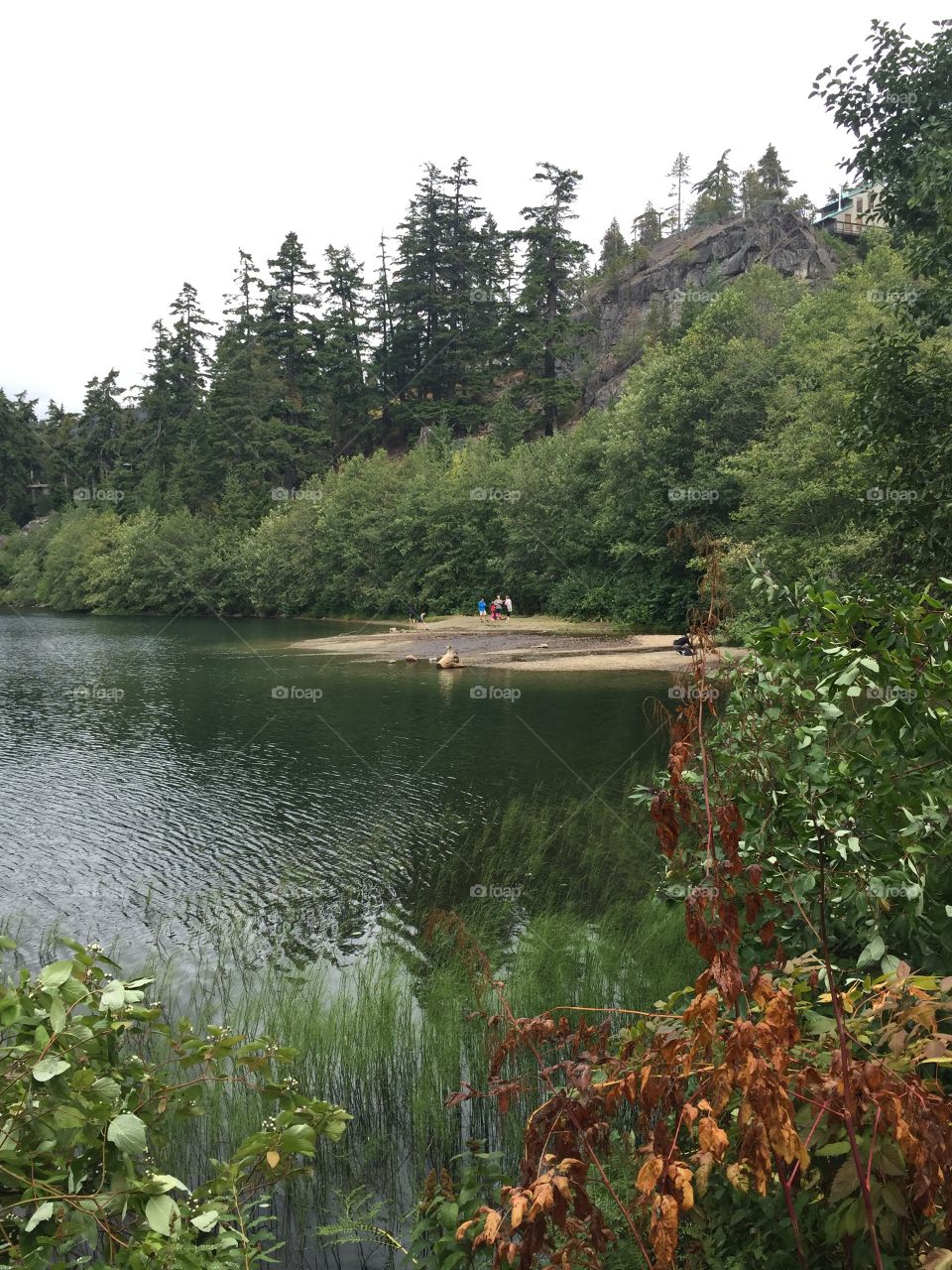 Family having fun on a cloudy day at Nitka Lake, Whistler, BC.