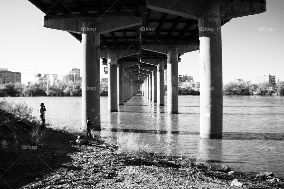 2 Men Fishing in The James River Under An Overpass
