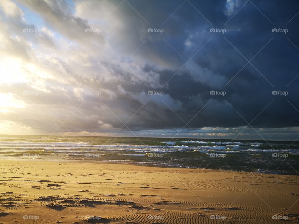 Sunset with a stormy weather on the Dune du Nord. Îles-de-la-Madeleine, Québec, Canada.