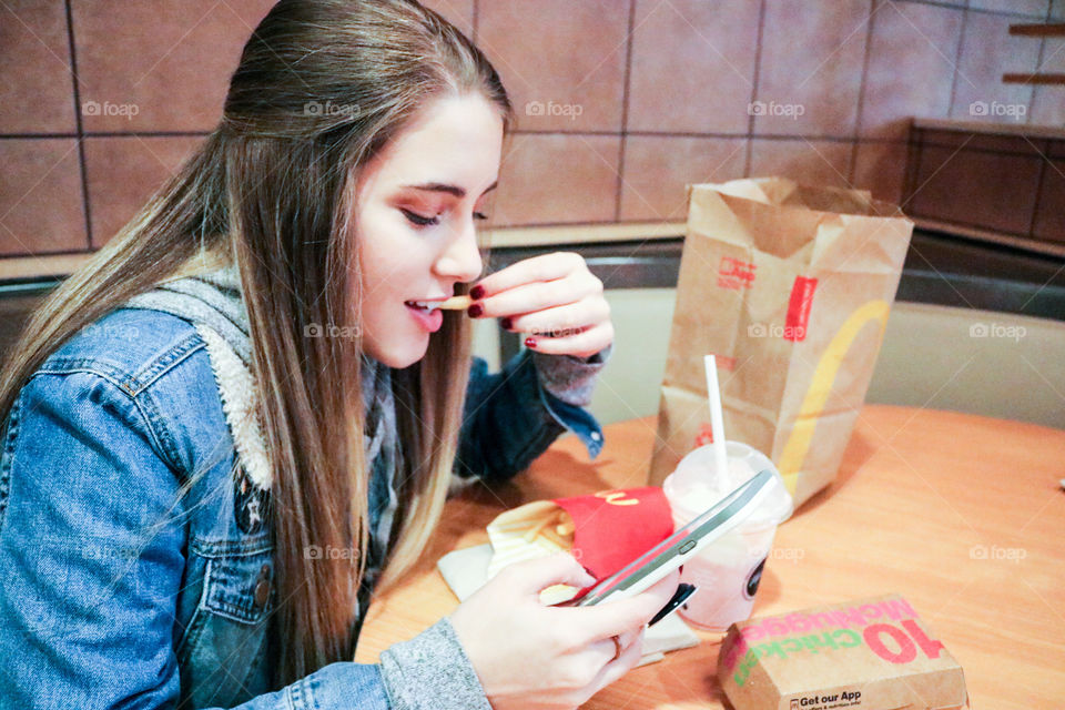 McDonald’s- girl eating at McDonald’s 