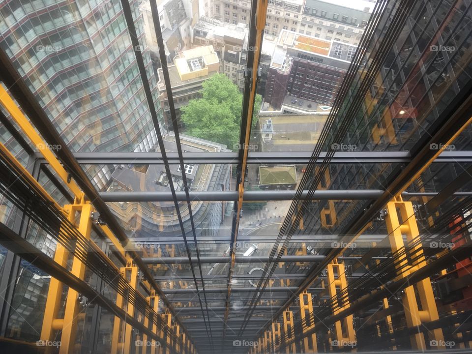 Looking down the lift shaft at the Leadenhall Building, in the City of London, from the 30th floor. Spring.