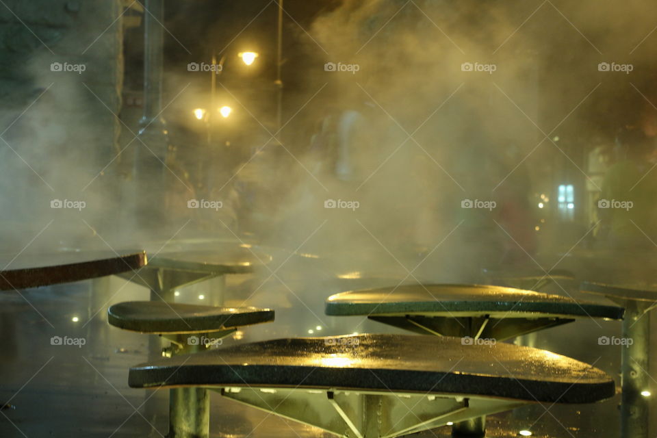 fog in the park. humidity on chairs