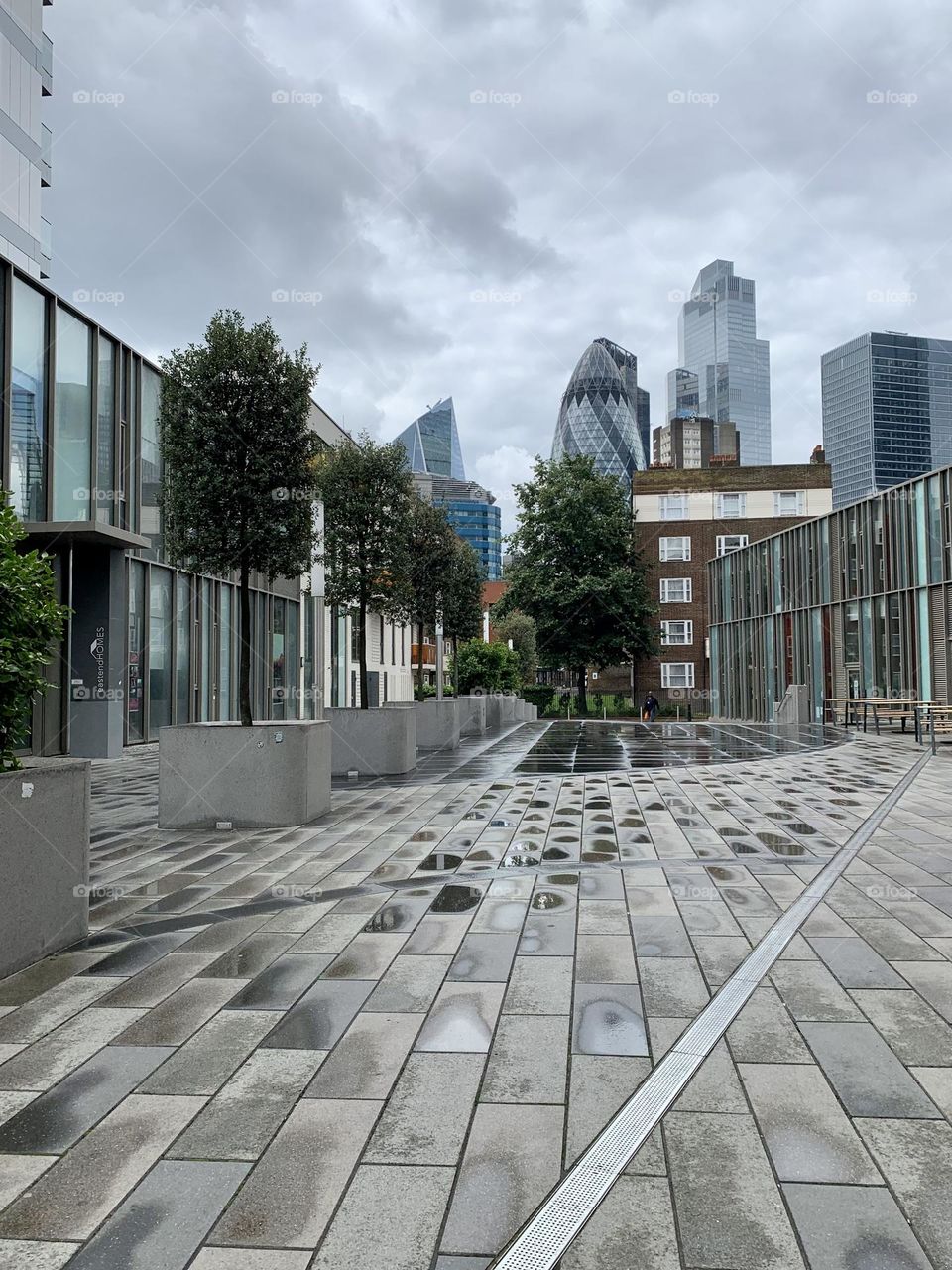 Rainy day in London, view of skyscrapers, Aldgate, glimpse of London quarter 