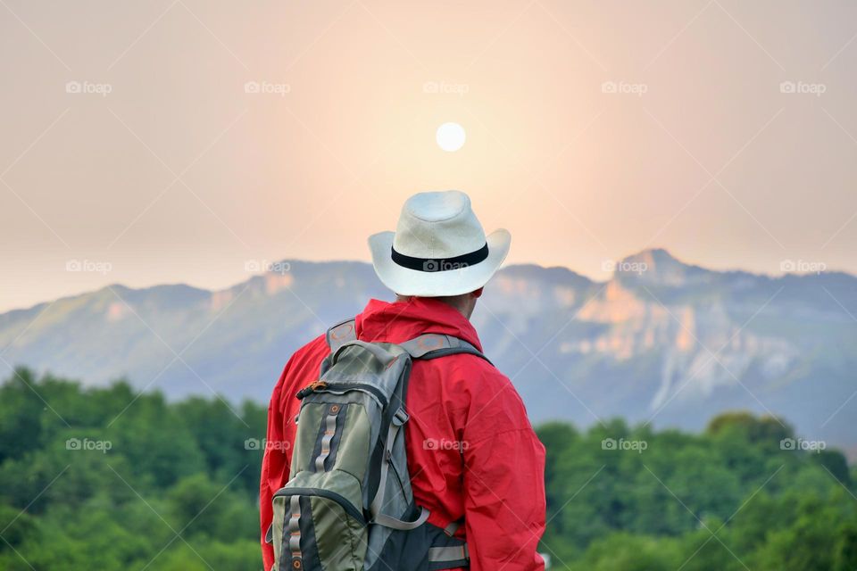 Person looking at the mountains 