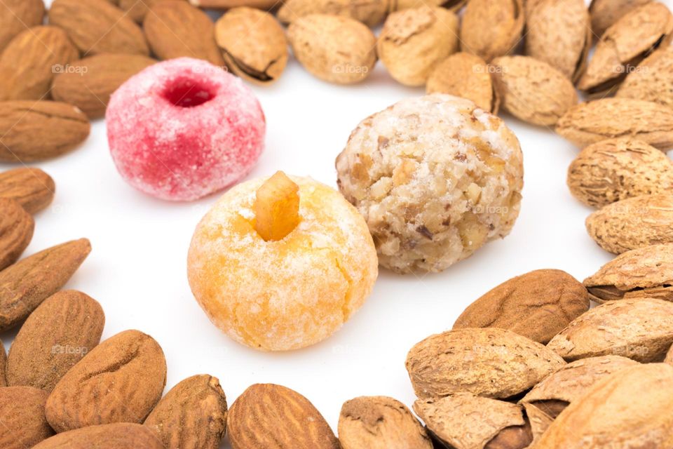 Panellets surrounded by almonds. Traditional sweet for All Saints' Day in Catalonia, the Balearic Islands, Levante and Aragon.