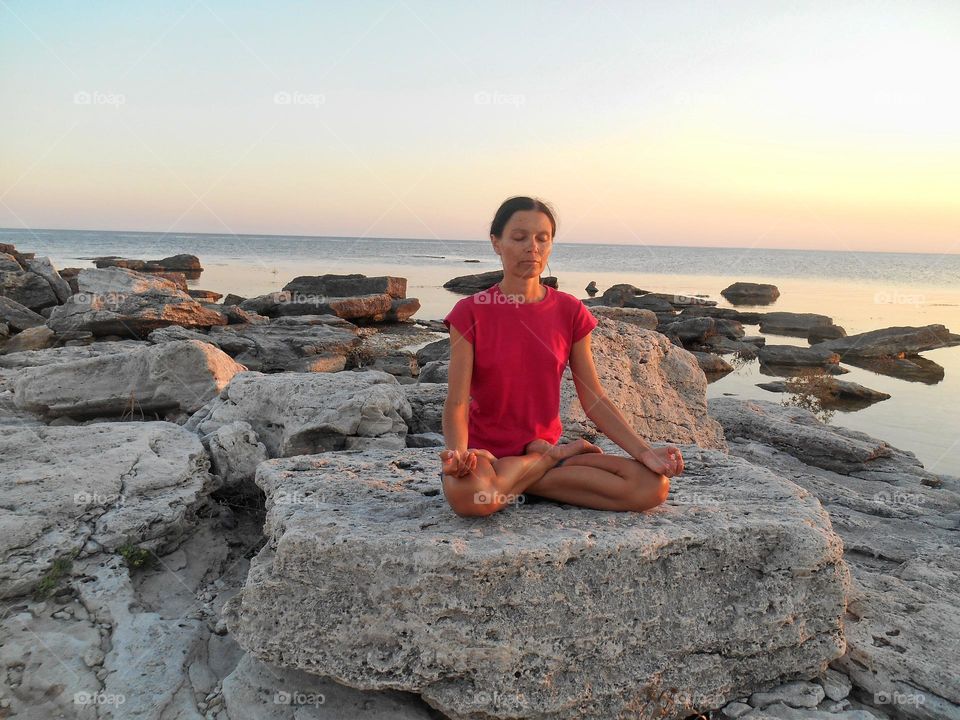 woman meditation on a sea shore