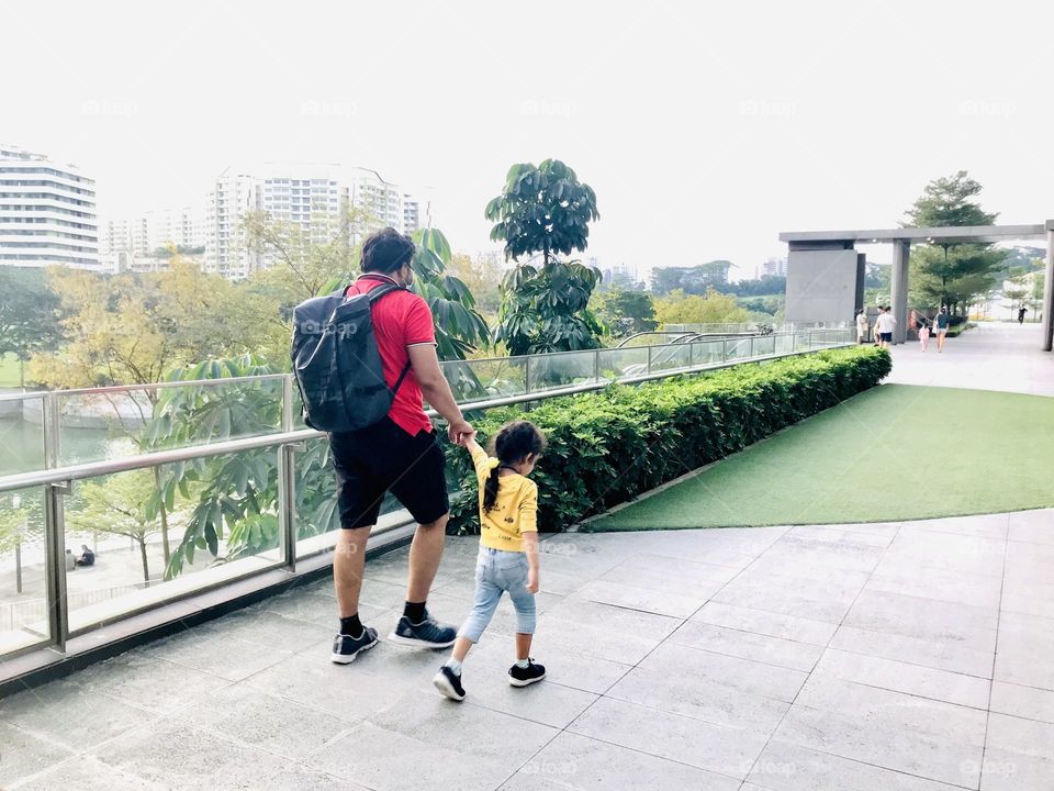 Father and daughter together walking 