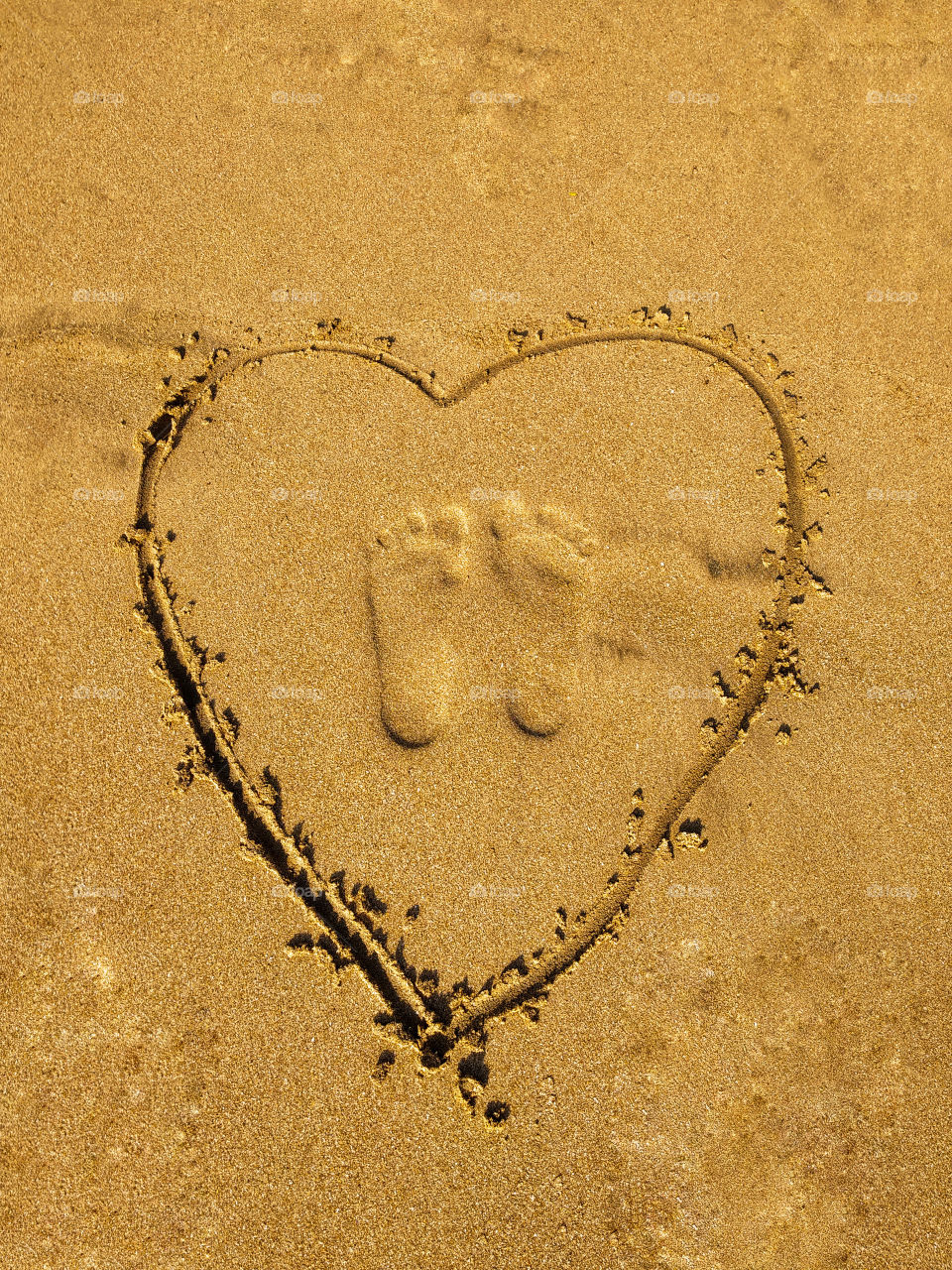 3d foot prints on beach