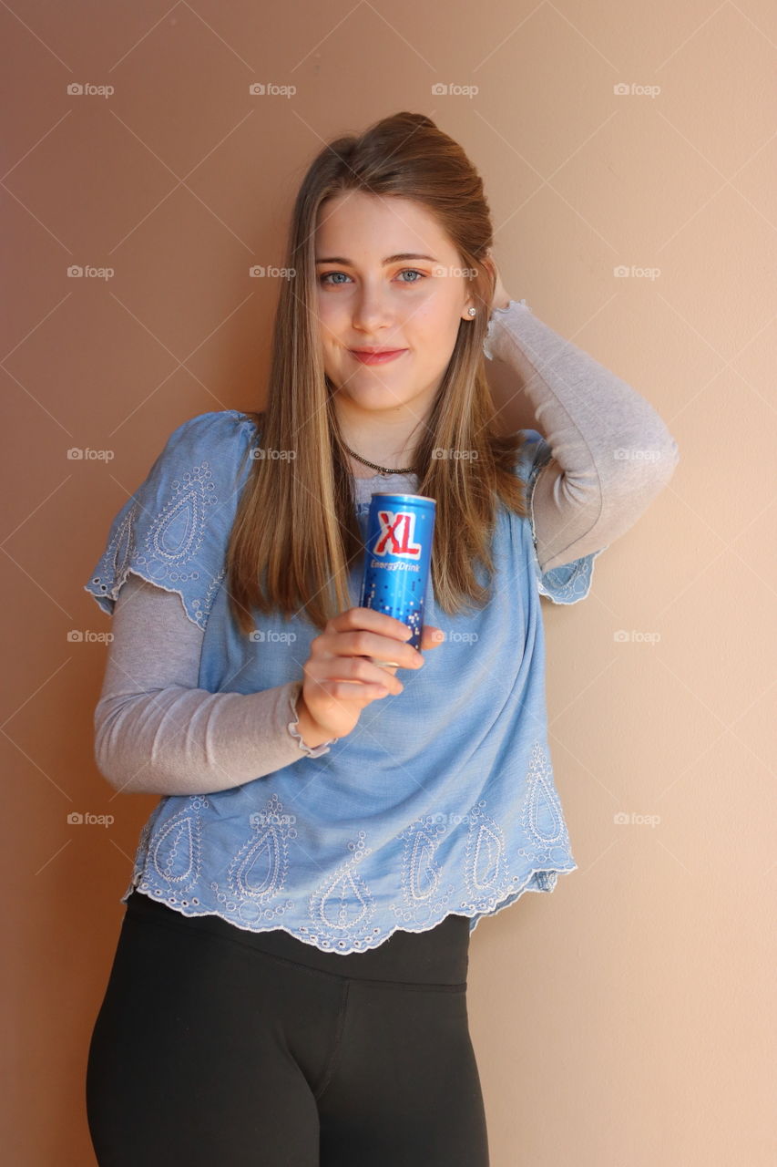 Daughter holding XL Energy Drink 