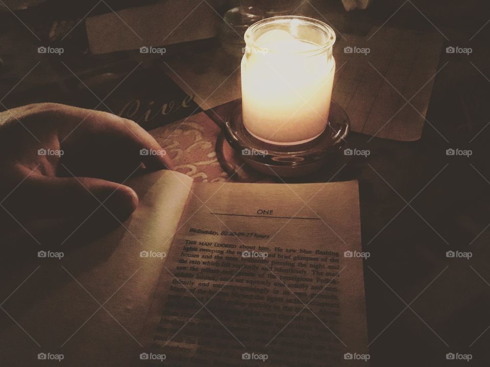 No power here in Florida. Attempting to read by candle light for entertainment. 