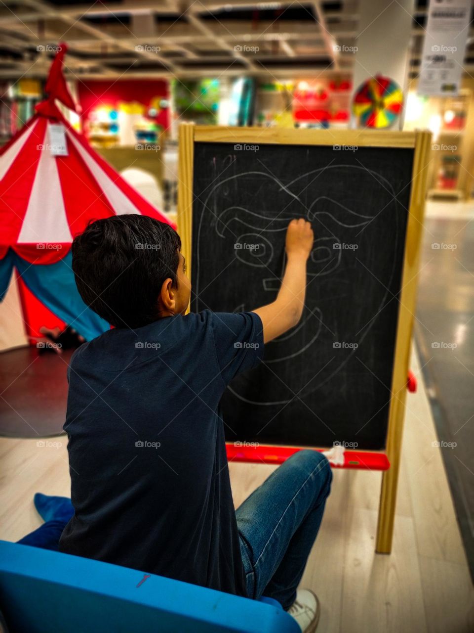 child drawing small moment of happiness