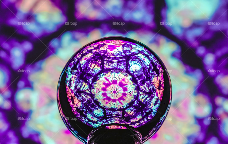 This is a pattern I designed from photographs I took of smoke, which I then added colour to and laid over each other to create a mandala like design. I’ve then photographed the design through a lens ball. Edited to enhance the purple tones