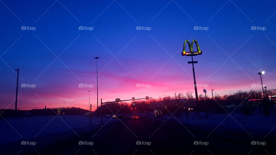 Reds sky highlighting the McDonalds sign.