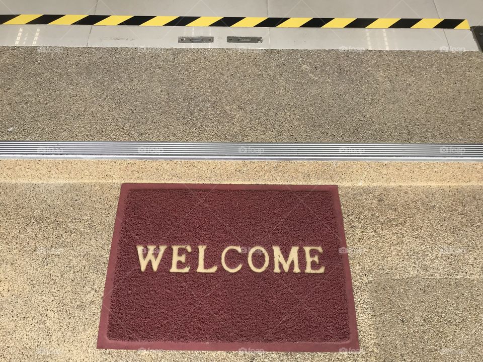 Welcome word on doormat 