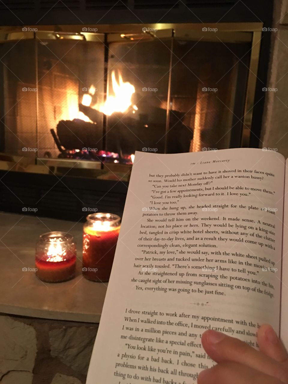 Reading peacefully by the fireplace