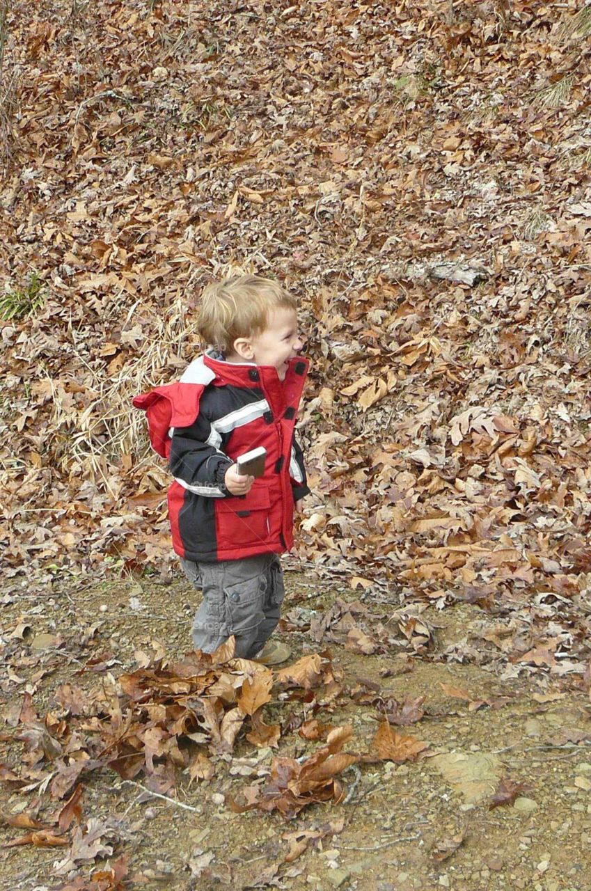 Boy in the leaves