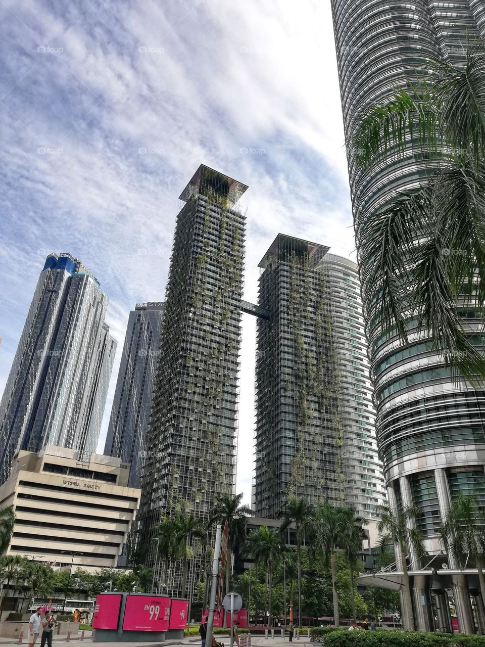 ultramodern skyscrapers of Kuala Lumpur in Malaysia surrounded by green plants