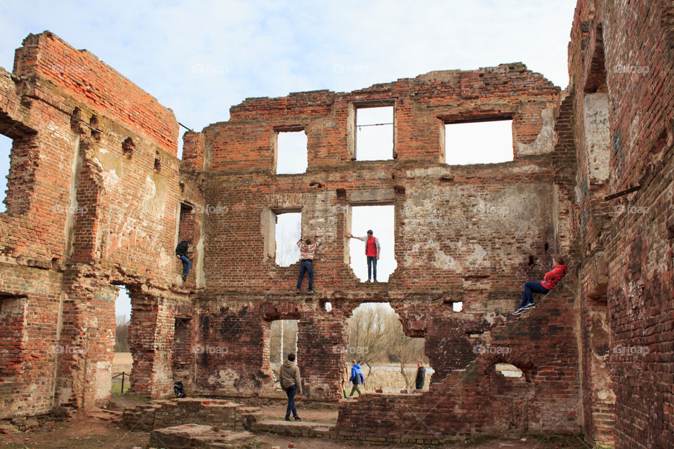 children play in the ruins of an old building