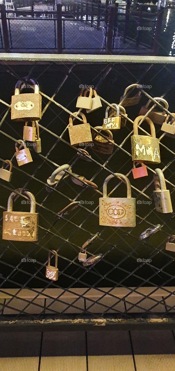 Promise bridge locks at night