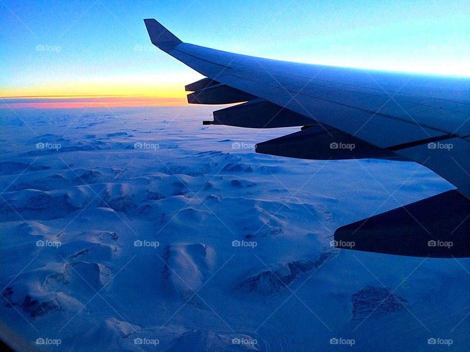 Flight over Greenland with frozen landscape