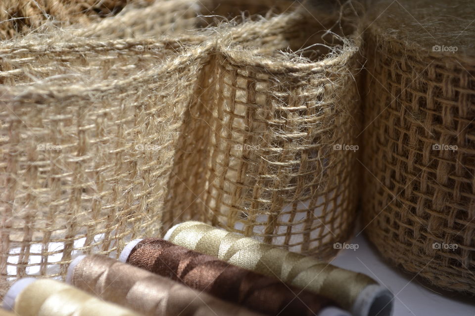 Sewing thread spools with burlap