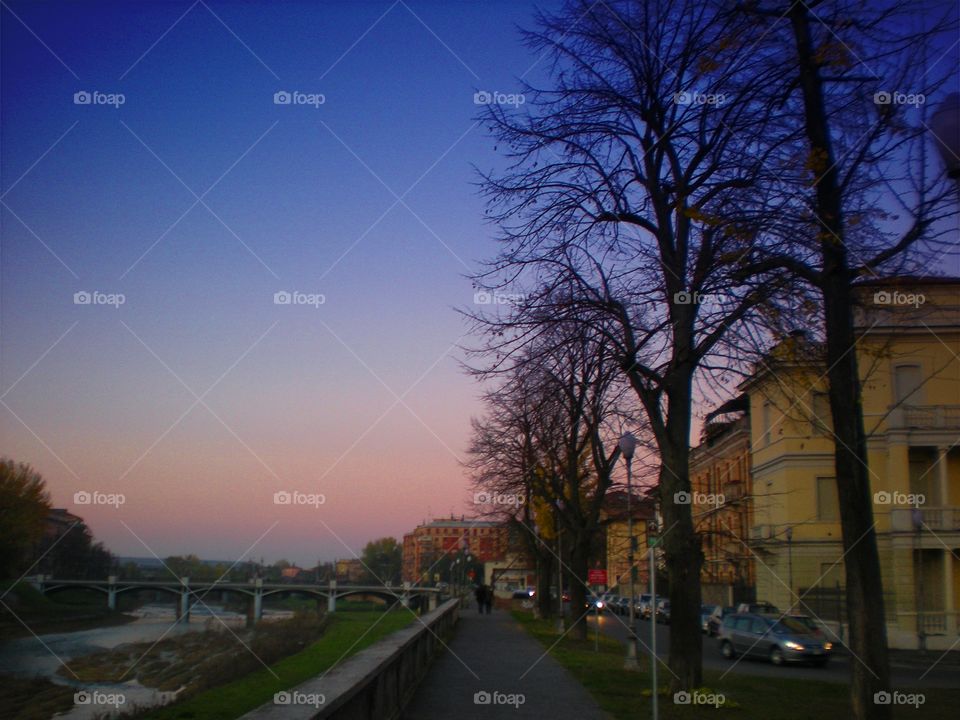 A road of Parma city ( Italy ) by night in autumn.