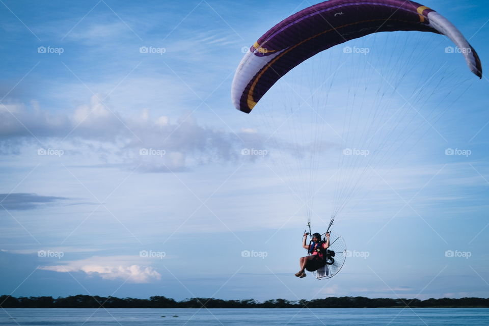 Flying paraglider
