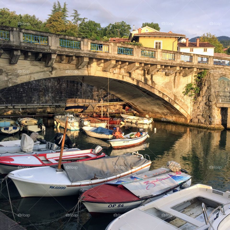 Boats and an old bridge. Opatilja, Croatia
