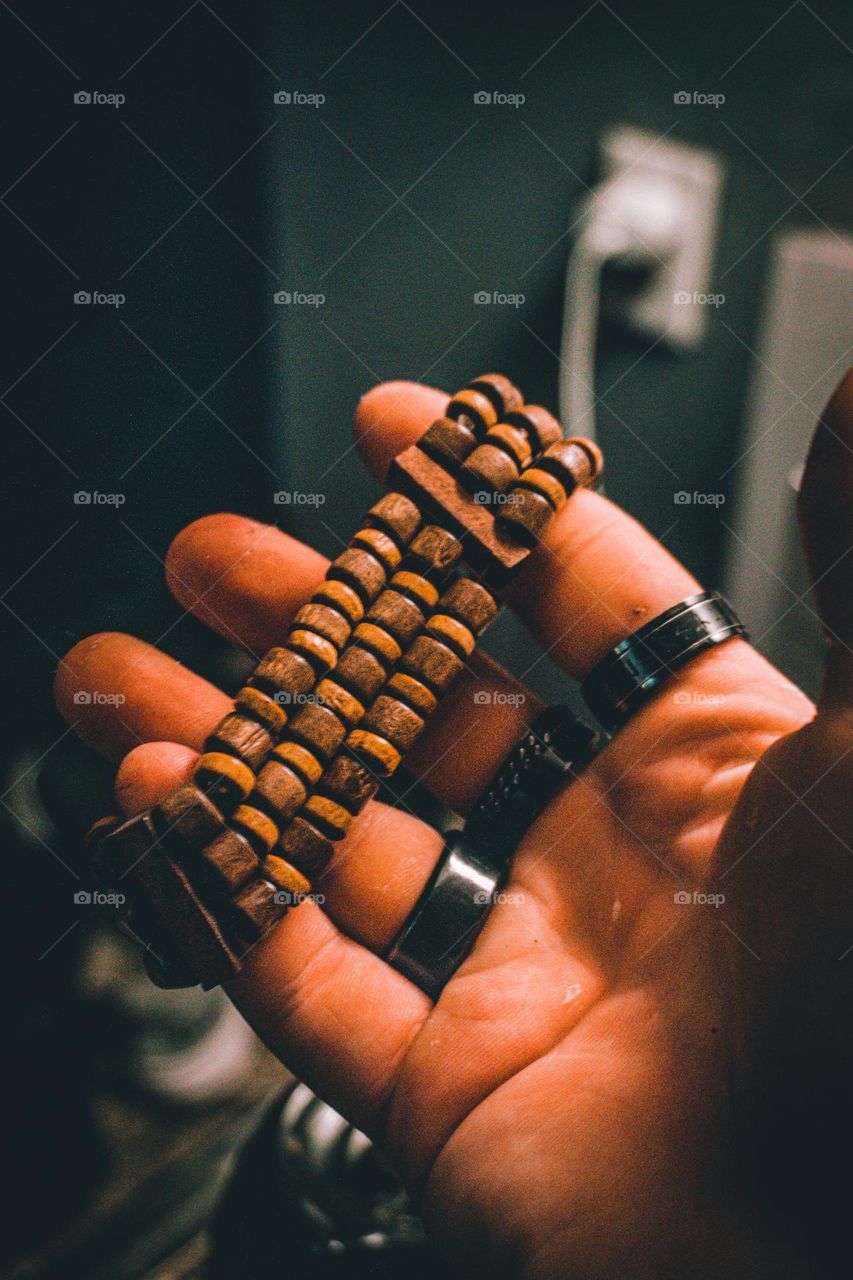 Dark scene with my wristband and rings.