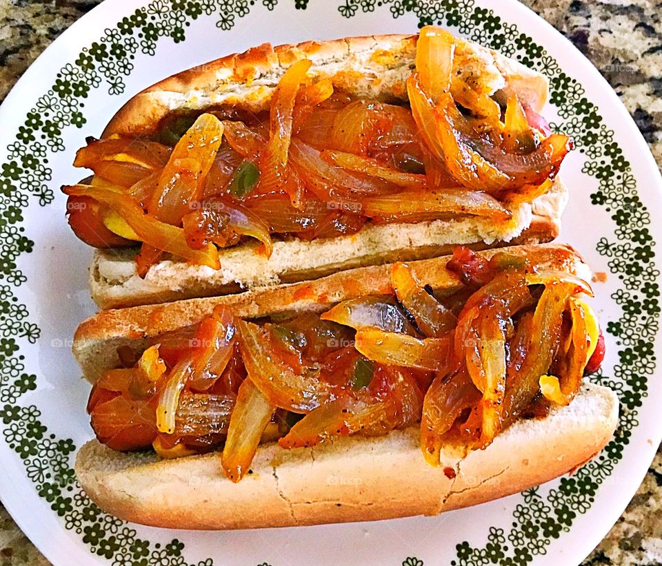 All beef hotdogs with spicy onions and tomato sauce 