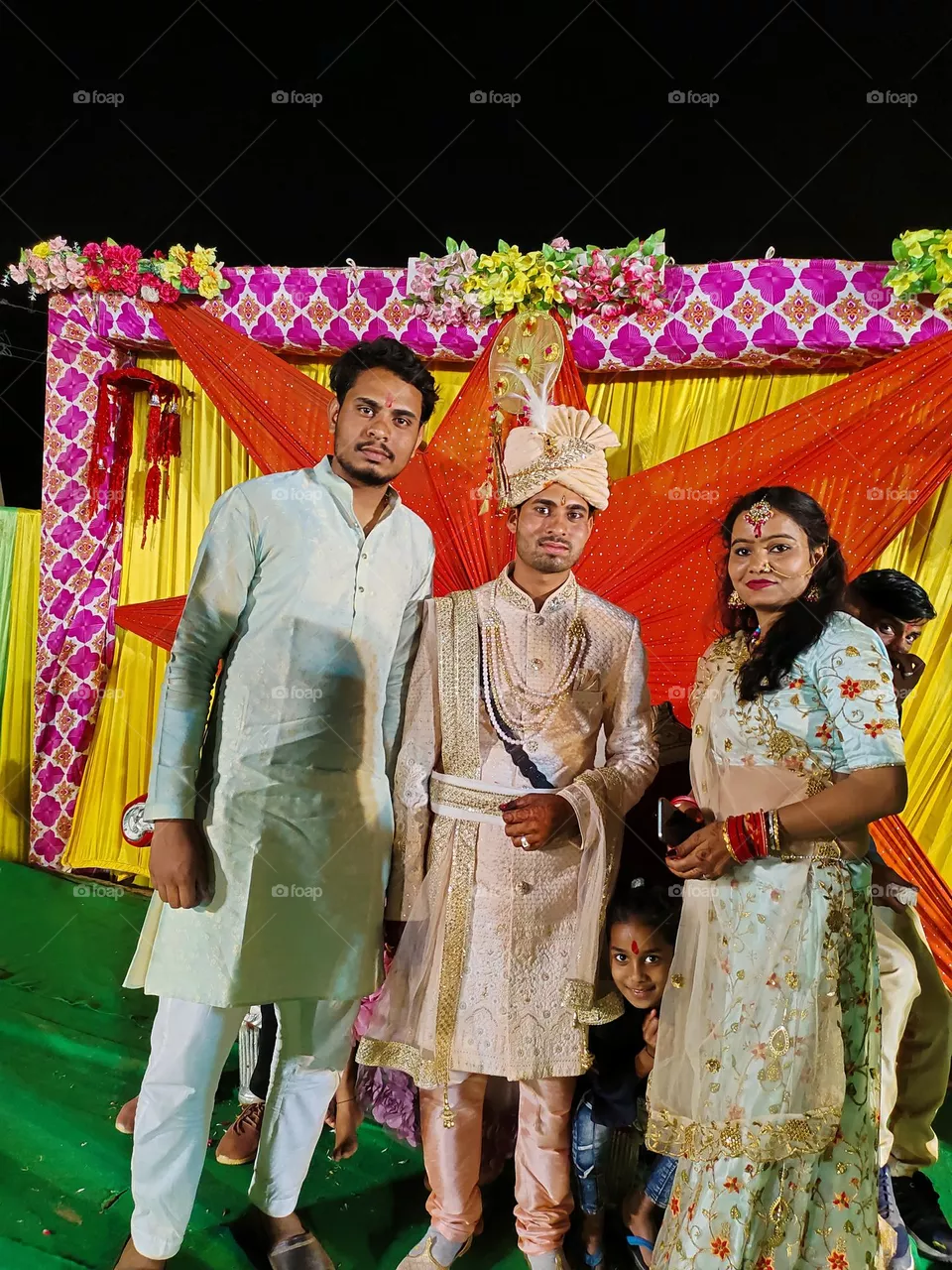 this photo capture by  my mobile phone iqoo Neo 6 and me and my mosi with my mama on his merriage stage function