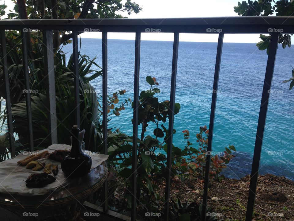 Ocean view and breakfast from the balcony of a villa at Frenchman’s Cove Beach and Resort , Portland Jamaica 
