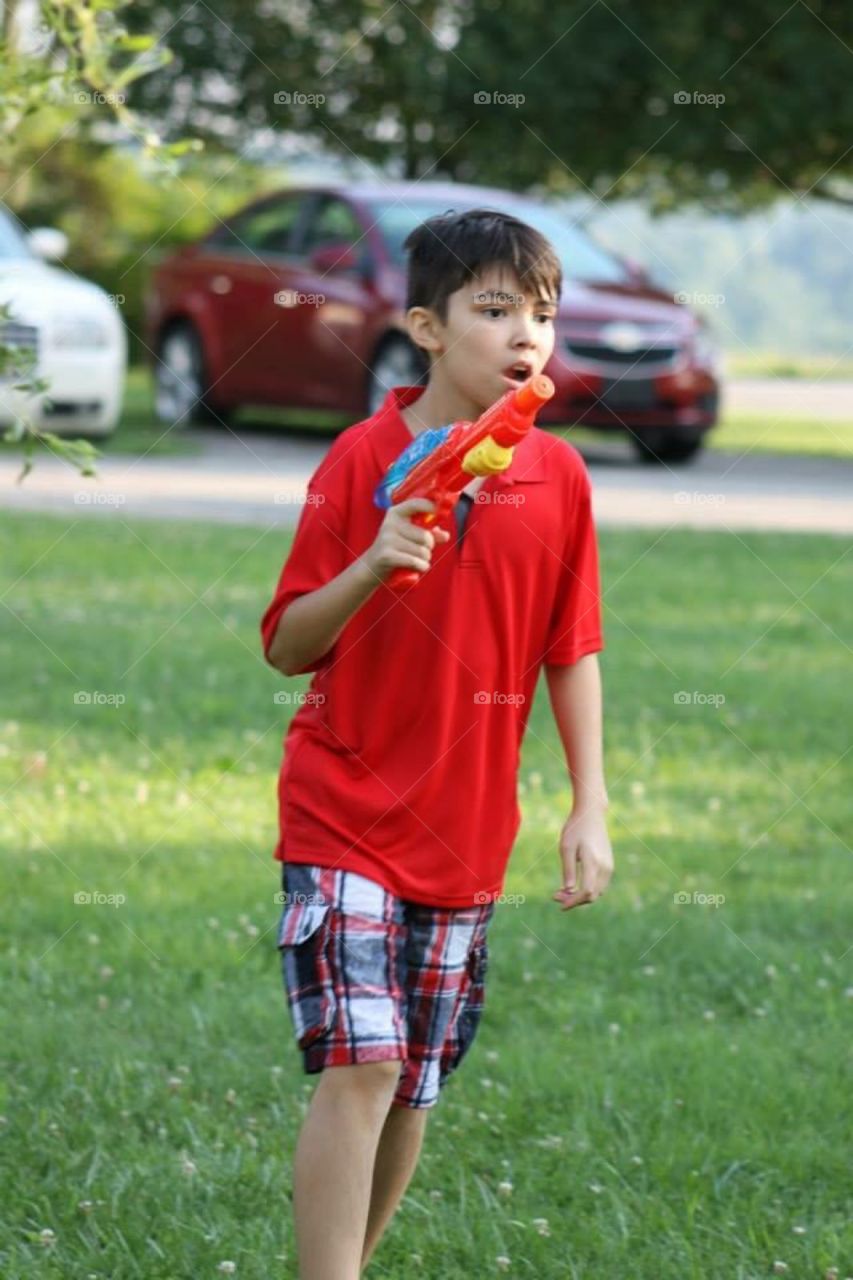 Boy with Water Gun 