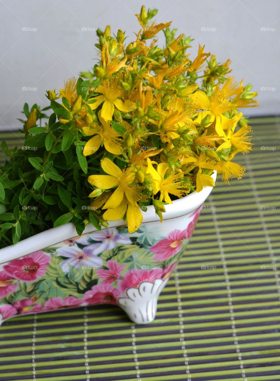 yellow flowers in vase