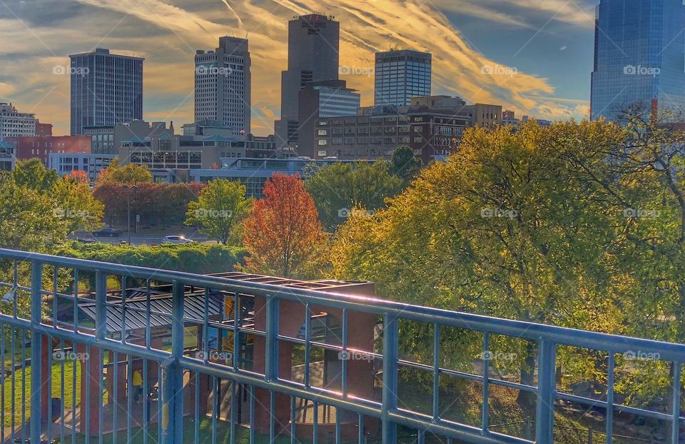 Little Rock Skyline in Fall - The Junction Bridge provides an awe-inspiring view of the Little Rock skyline framed  with colorful  fall trees. 