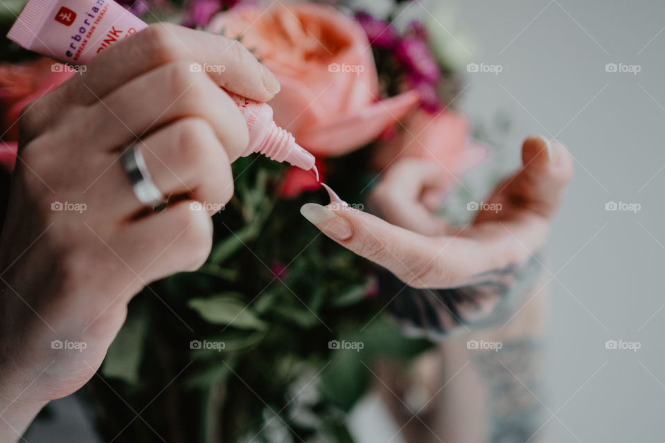 skin care product and flowers