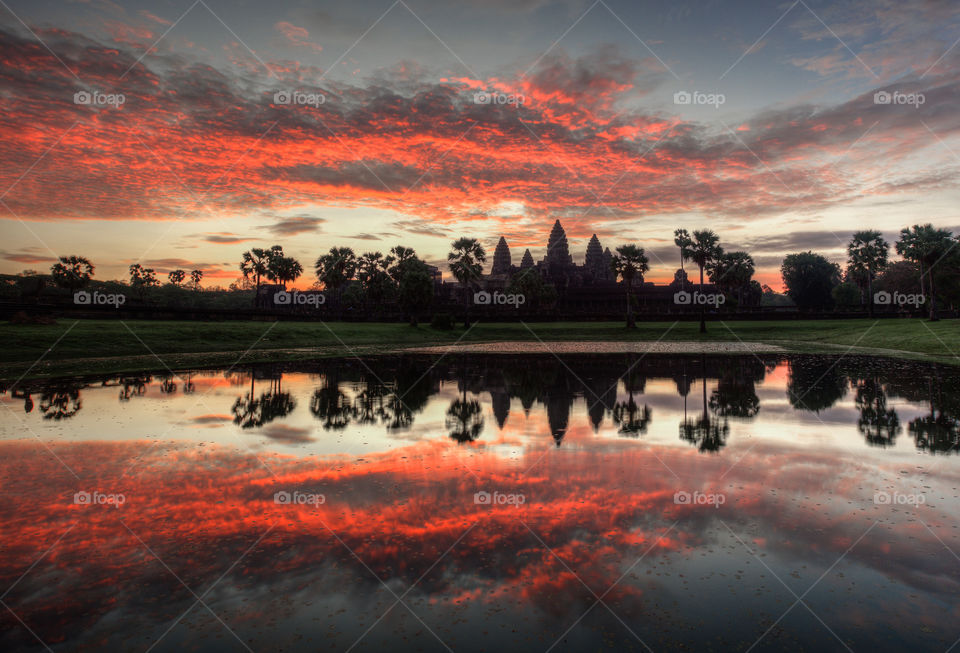 Angkor wat temple in a fiery morning sunrise
