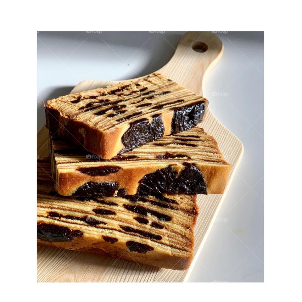 Indonesian popular snack kueh lapis layered cake in bright setting In The kitchen 