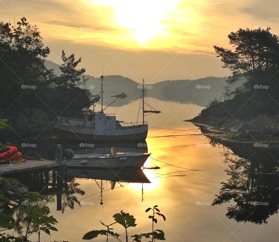 Quiet sunrise with boat