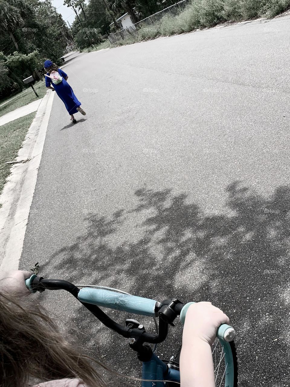 Two Girls Riding Their Bicycle And Scooter On The Street Carrying Their Belongings In Their Stylish Backpack With Blue And Pink Backpacks And Modest Clothings.